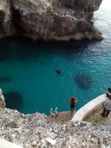Cliff diver preparing to jump